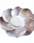 Grey leather camellia brooch with concealed magnetic fastening