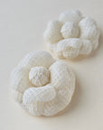 Set of ivory camellia brooches in different sizes