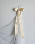 Long ivory wedding veil attached to the "Before yes" embroidered hanger clip, bridal morning photo inspiration.