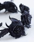 Detailed view of the FIONA black rose tiara, highlighting the fine wirework, hand-shaped silk leaves, and delicate bead accents on a professional couture bridal headpiece.