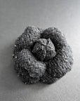 Handmade black tweed camellia brooch with subtle silver sparkles, textured fabric flower pin for blazer or coat