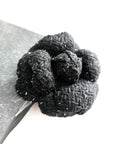 Handmade black tweed camellia brooch with subtle silver sparkles, textured fabric flower pin for blazer or coat