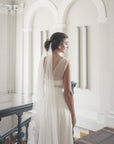 Side view of Elizabeth draped veil, architectural hexagonal weave English tulle, minimalist bridal silhouette.
