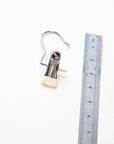 Wedding veil hanger detail — silver hook and offwhite clip