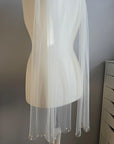 Minimalist bridal look with sheer wedding scarf and Preciosa pearls