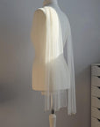 Lightweight Italian tulle bridal scarf styled over the shoulders