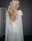 Bride wearing PARIS detachable bridal cape veil with bows in ivory