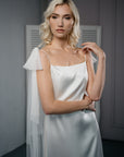 Modern bride in non-veil wedding look with PARIS detachable cape