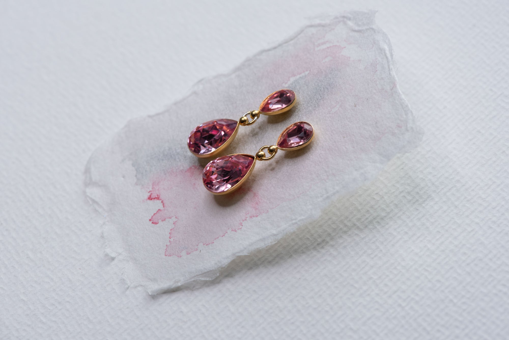 Rose color crystal earrings REGN