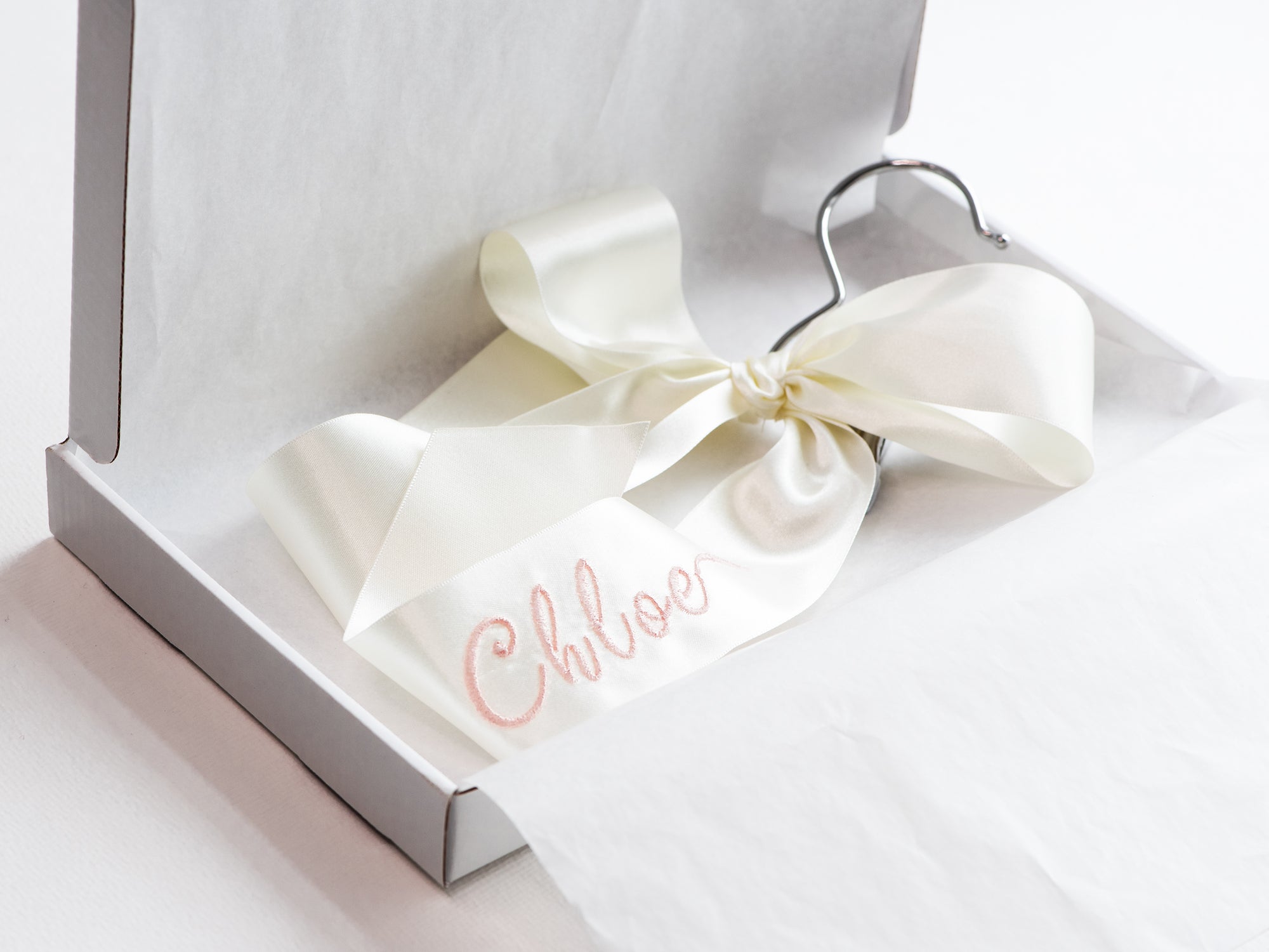 Embroidered satin ribbon bow on personalized veil hanger