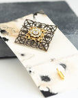 VERITAS sacred geometry wedding boutonniere in brass with glass crystals