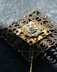 VERITAS sacred geometry wedding boutonniere in brass with glass crystals