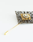 VERITAS sacred geometry wedding boutonniere in brass with glass crystals
