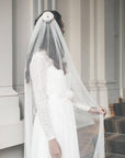 Bride wearing JANE simple narrow veil in soft English tulle — ivory