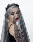 Close-up of LZZY black laurel leaf headpiece in gothic bridal style