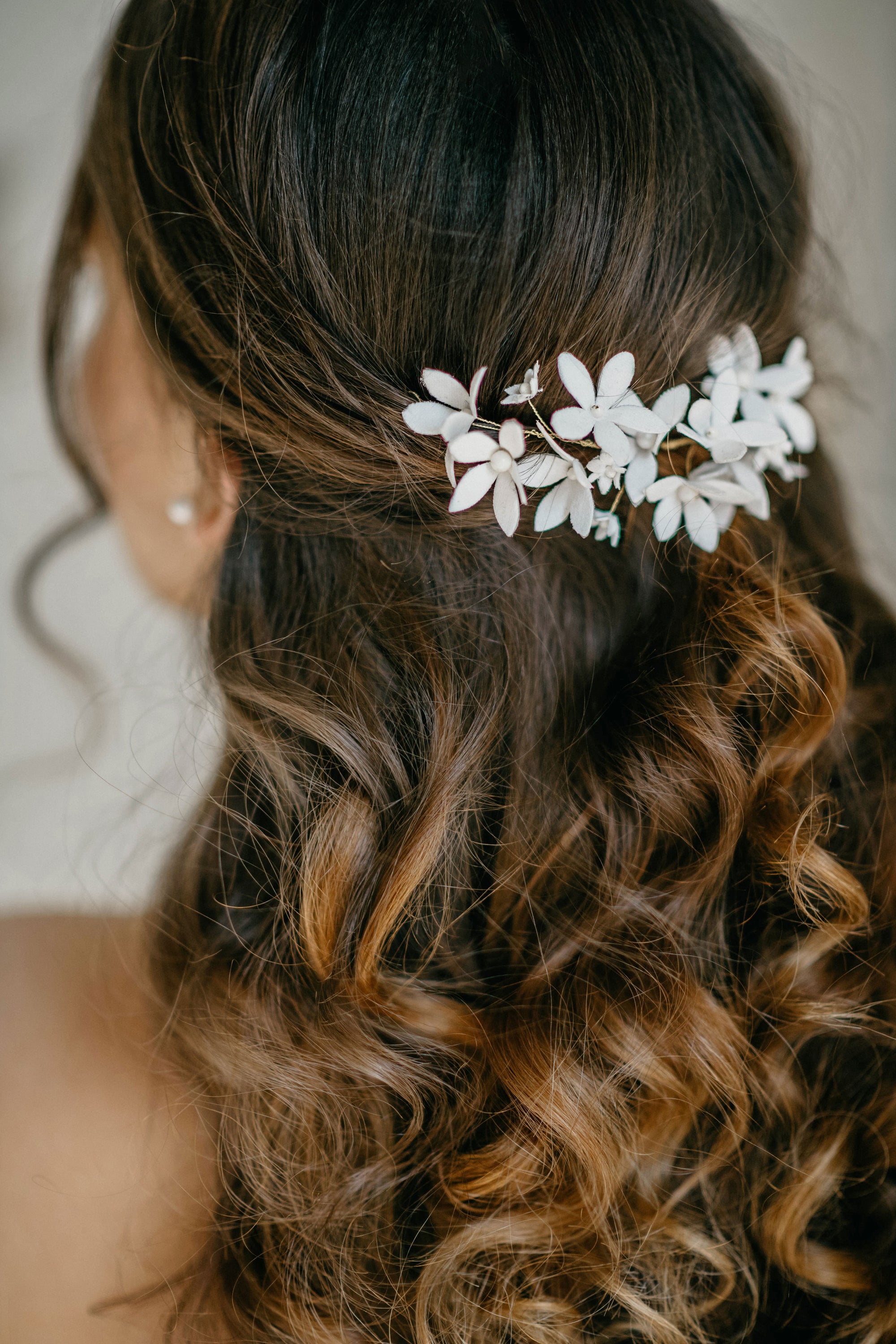 Bridal hair vine styled at the back – romantic jasmine blossom design