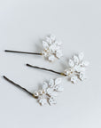 Set of three white frosted bridal hair pins with pearl accents