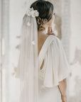 bride with soft English petal veil and silk roses