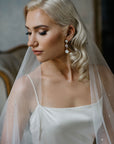 Bride with drop white opal earrings by floraljewellery