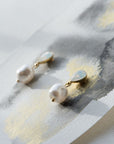 Close-up of PERELLA baroque pearl bridal earrings with crystal accents