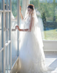 Modern bride wearing CLOTILDE golden laurel bridal headband with wedding veil