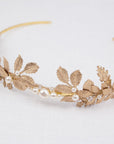 CARPO bridal headband showing the detailed veins of gold brass oak leaves and hand-wrapped ivory pearls on a slim gold wire base.