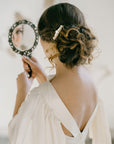 Handcrafted pearl and crystal bridal hair comb in gold finish for wedding updos.