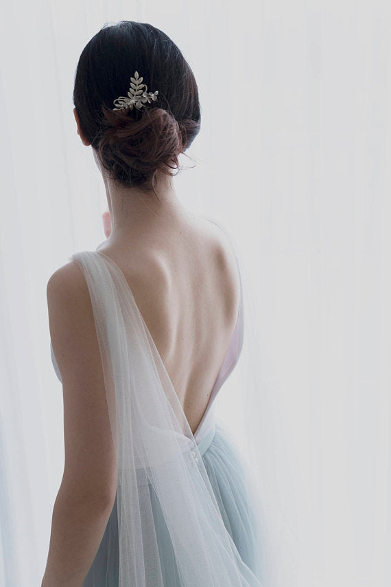 Bride wearing custom color cape veil