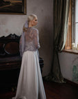 Bride wearing TATIANA hair bow – Swiss dot tulle in dusty blue