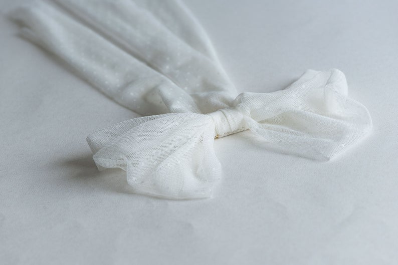 Tatiana Hair Bow displayed on a white background, crafted from Swiss dot tulle with a tulle-wrapped metal comb. Perfect for weddings and special occasions