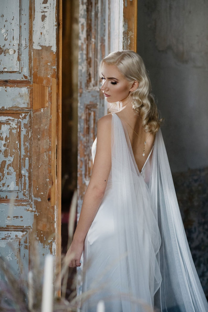 Bride with cape veil wiith back necklace
