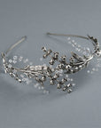 Top view of the LILY bridal tiara, displaying the intricate arrangement of silver flowers and jewelry wire work.
