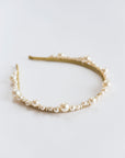 Close-up of delicate pearl and crystal bridal tiara details