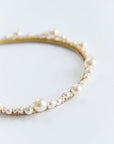 Close-up of delicate pearl and crystal bridal tiara details