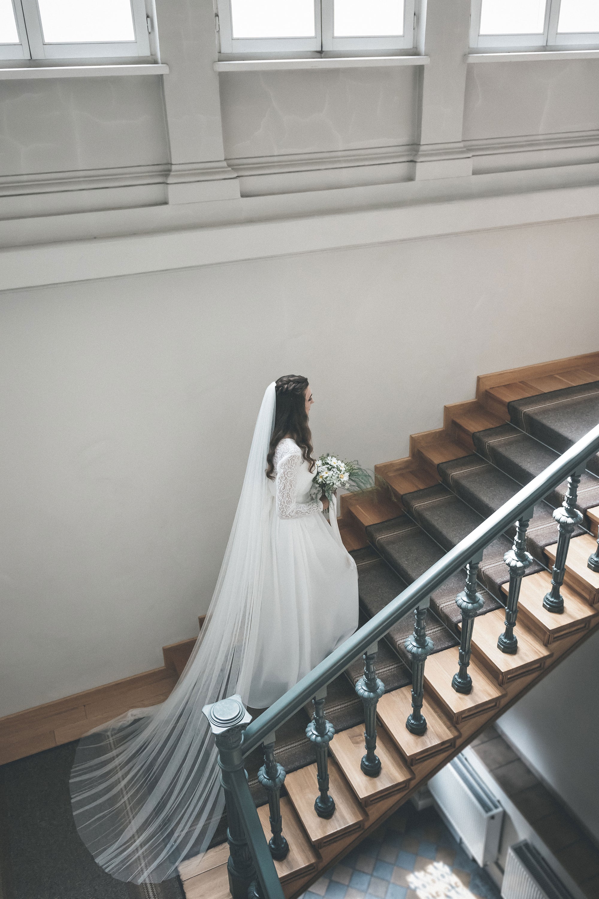 Bride wearing HARRIET wide cathedral veil made of soft English tulle, flowing in natural light