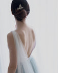 Soft English tulle bridal cape veil draping over bride’s shoulder, lightweight veil alternative