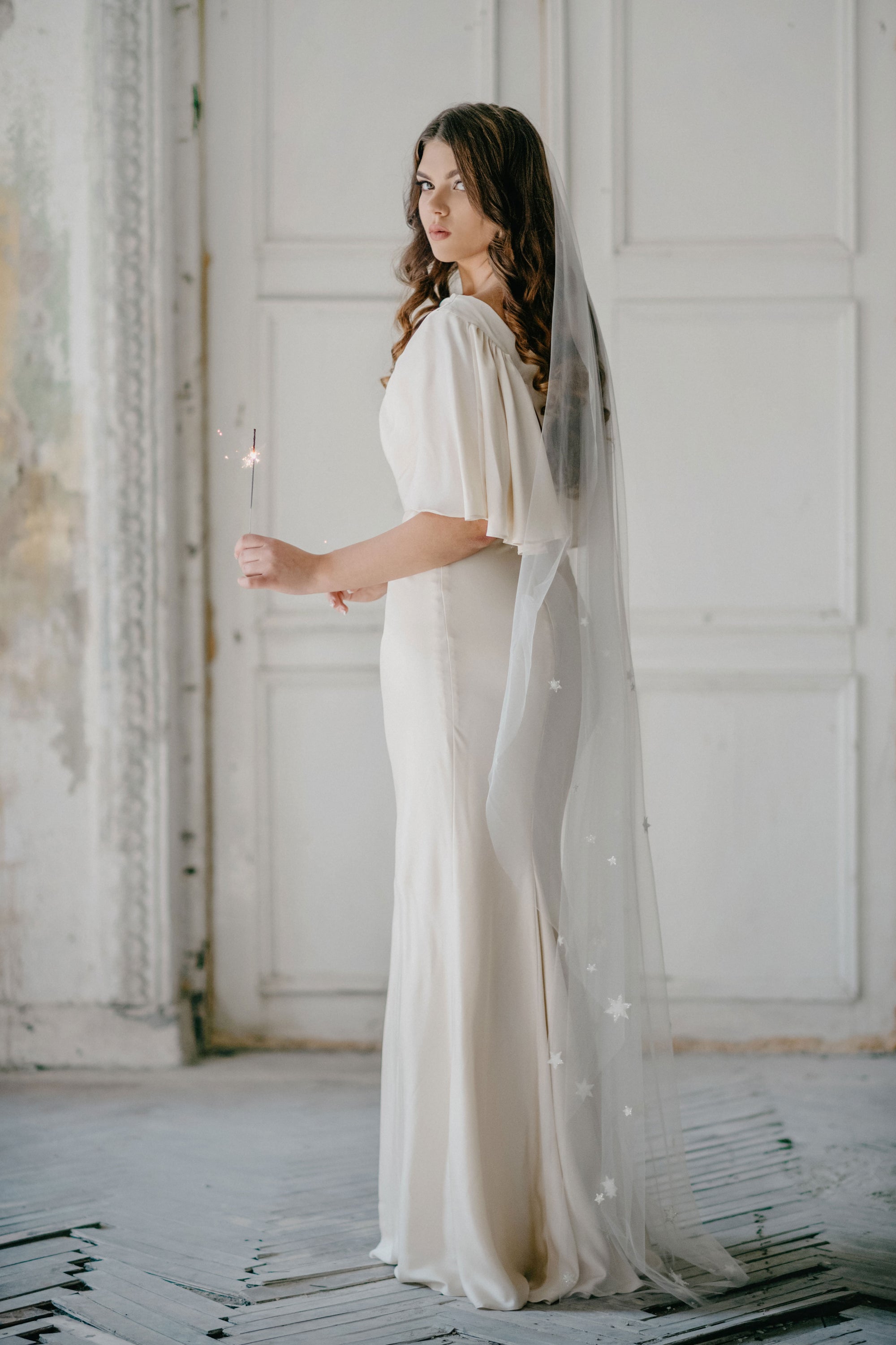 Bride wearing COELESTINE star veil with beaded celestial details – celestial bridal lookwith celestial veil