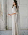 Bride wearing COELESTINE star veil with beaded celestial details – celestial bridal lookwith celestial veil