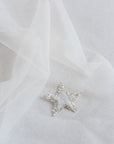 Close-up of beaded star appliqués with silver glitter on Italian tulle – COELESTINE celestial bridal veil