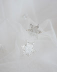 Close-up of beaded star appliqués with silver glitter on Italian tulle – COELESTINE celestial bridal veil