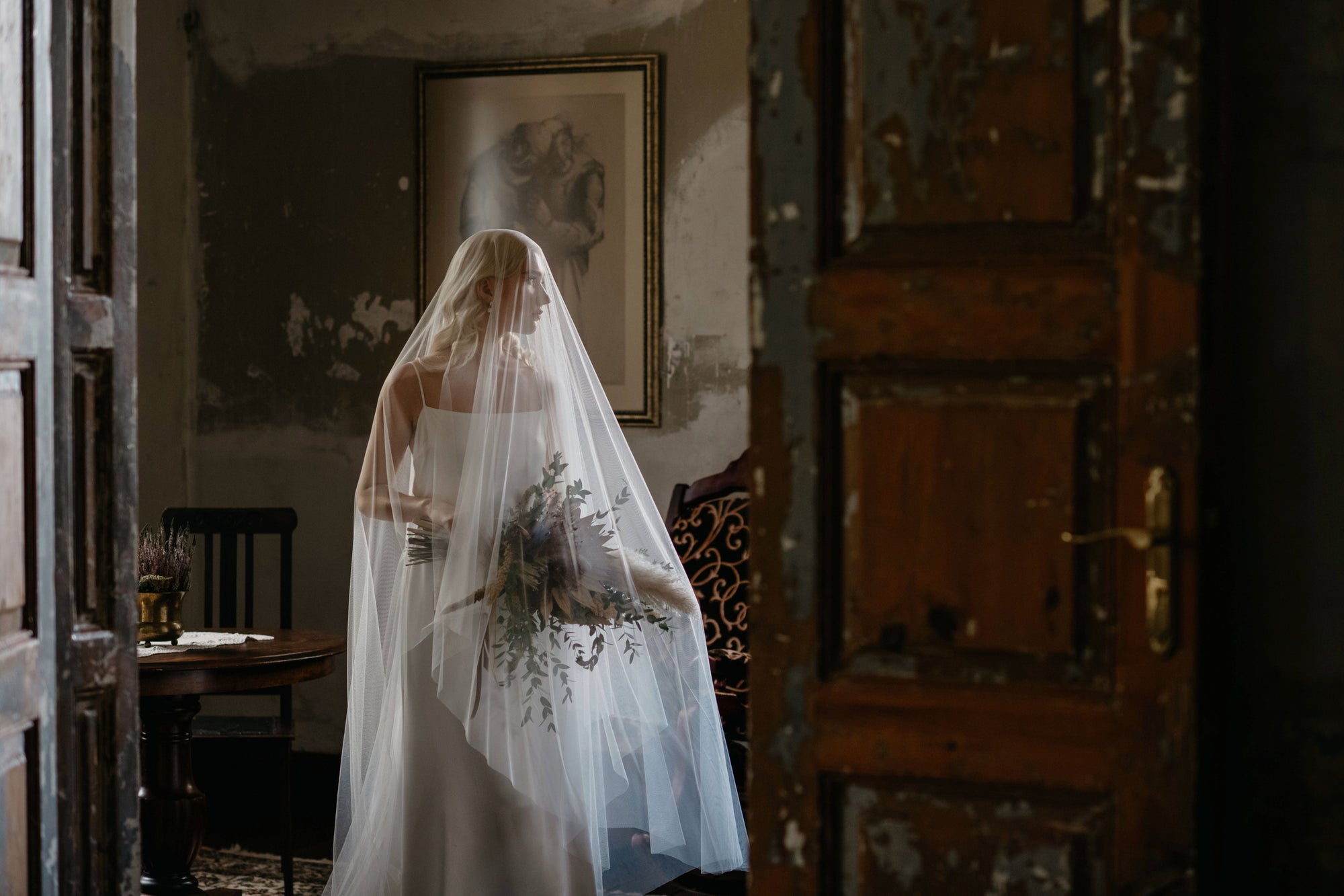 Bride wearing English tulle veil with soft, airy drape
