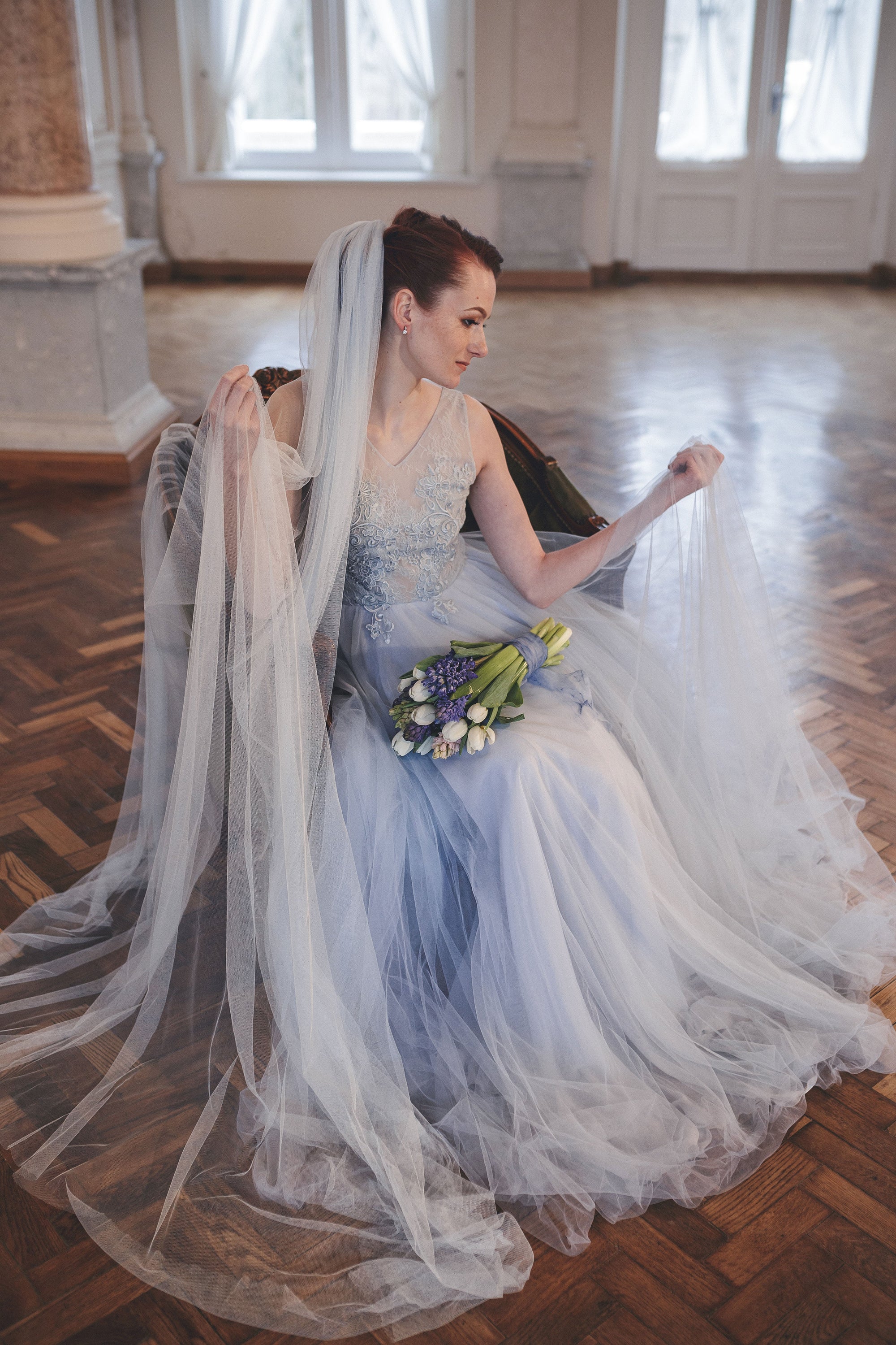 Wedding veil paired with light blue wedding dress, illustrating veil color matching and shades of white for bridal styling