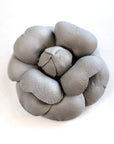 Grey leather camellia brooch with sculptural layered petals and matte finish