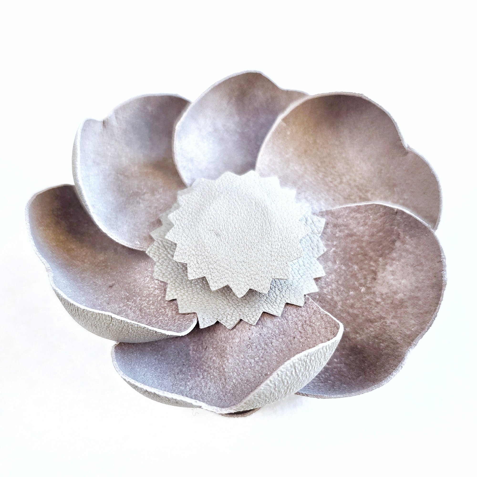 Grey leather camellia brooch with concealed magnetic fastening