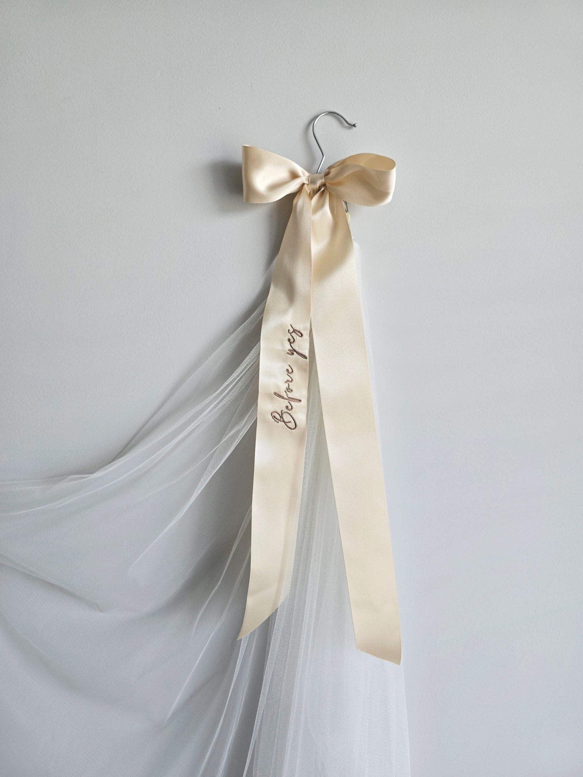 Long ivory wedding veil attached to the "Before yes" embroidered hanger clip, bridal morning photo inspiration.