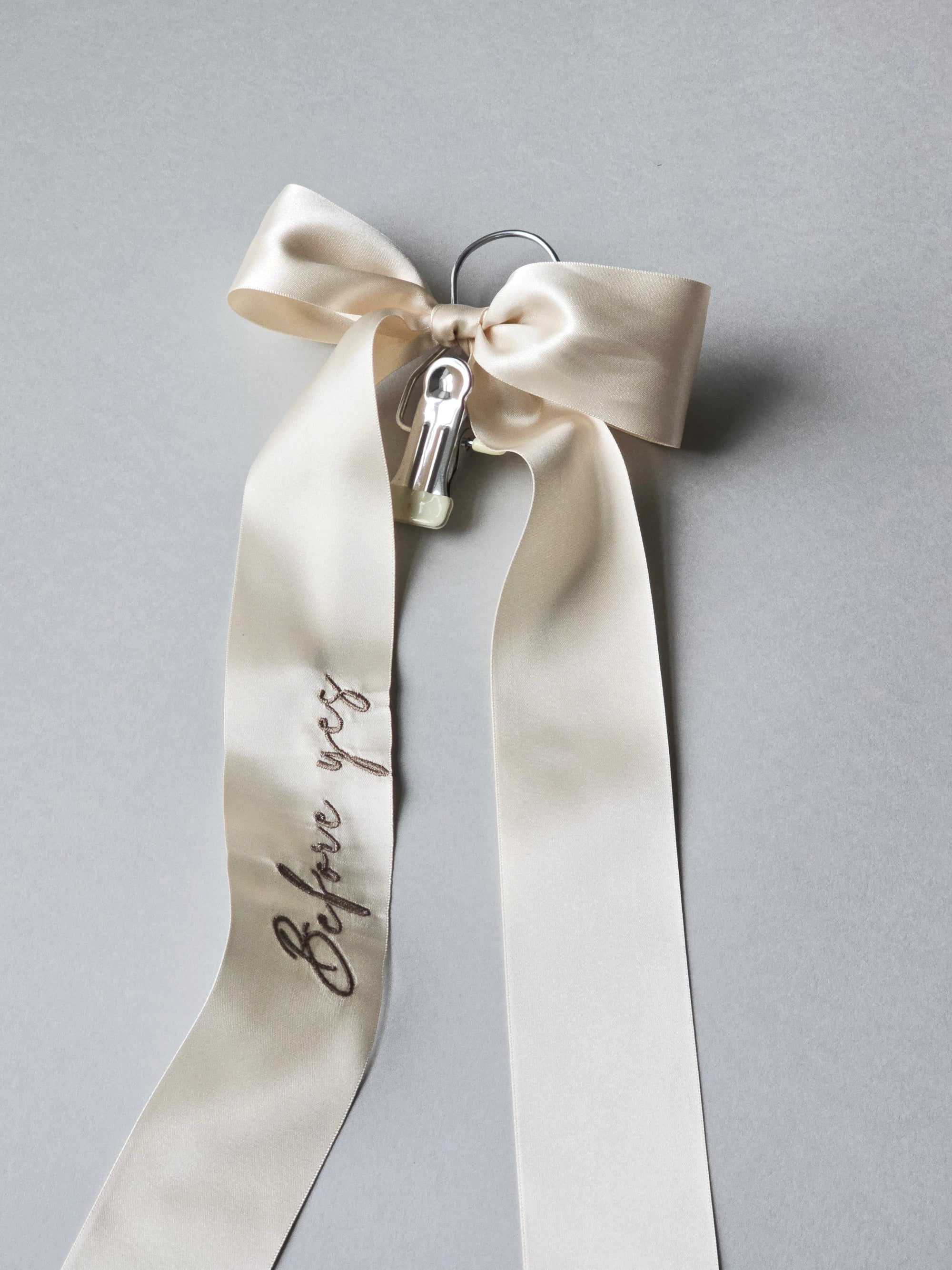 Wedding veil hanger with "Before yes" embroidery on an champagne color satin bow