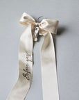 Wedding veil hanger with "Before yes" embroidery on an champagne color satin bow
