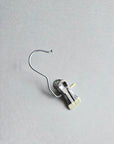 Detailed shot of the high-tension silver metal clip and hook, designed to hold delicate wedding tulle without snagging.