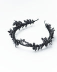 Frontal perspective of the LZZY black tiara on a bride, demonstrating how the architectural leaves frame the face without overwhelming it.