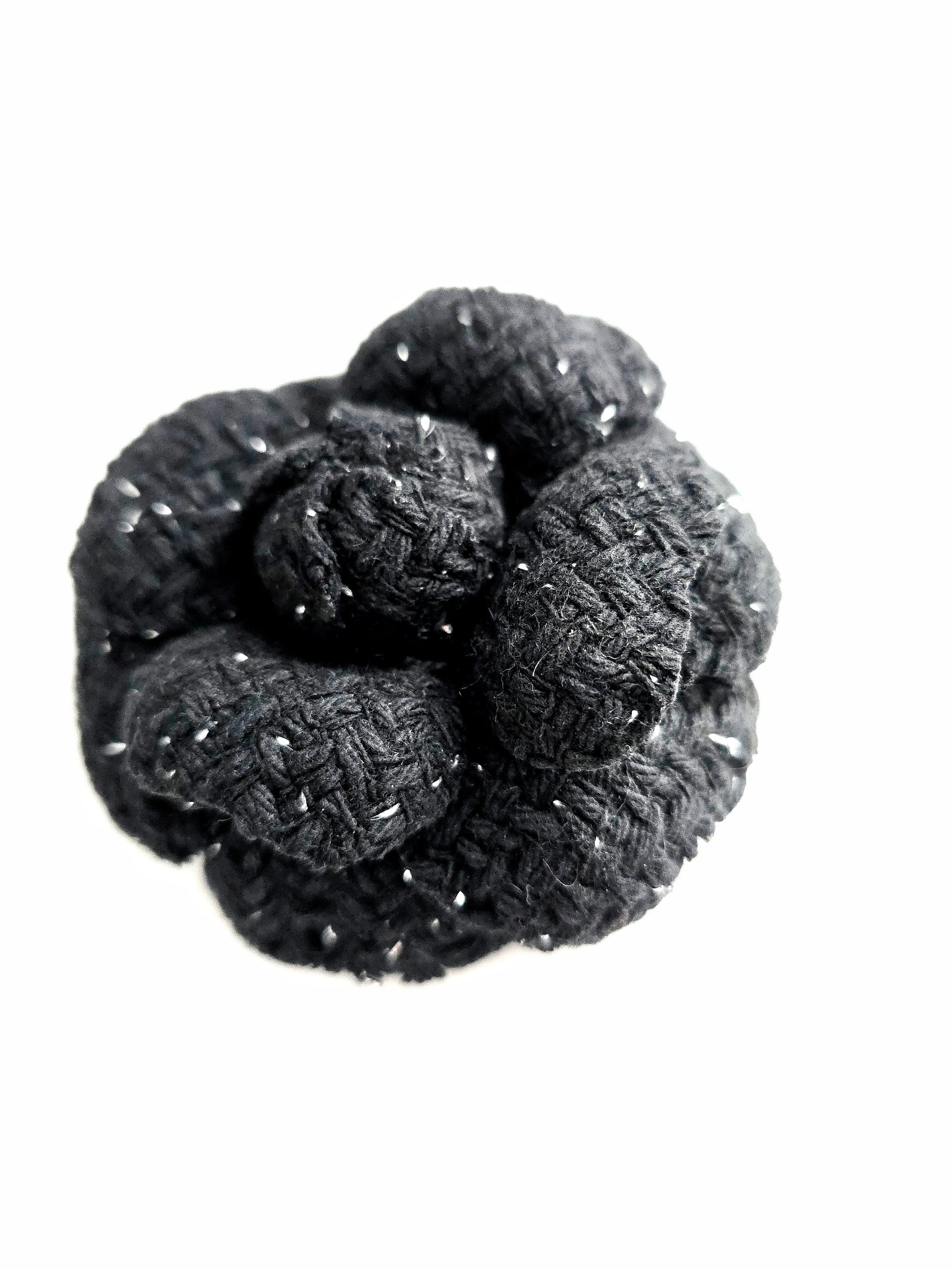 Handmade black tweed camellia brooch with subtle silver sparkles, textured fabric flower pin for high-fashion elegance
